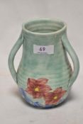 An Art Deco Radford three handled vase hand painted with floral scene.