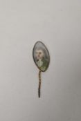 An 18th century tie or dress pin having hand painted scene of a Georgian man.