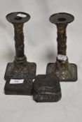 A pair of early 20th century chinoiserie candlesticks with two trinket boxes.