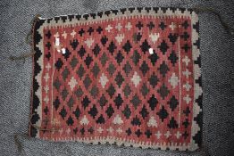 A 20th century Persian Afghan Balouch salt bag in woven wool in a cream and red ground 80cm x 55cm