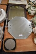 A selection of vintage mirrors including a mid century hexagon mirror with mythical beast