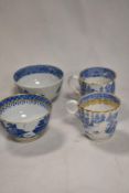 Two Victorian tea bowls with transfer printed designs and two similar 18th century porcelain tea