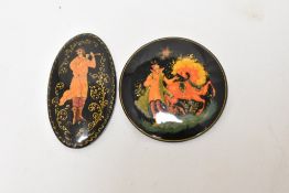 Two 20th century hand painted Russian brooches one being of very fine quality.