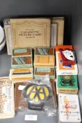 A good selection of early 20th century cigarette cards and playing card packs.