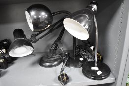 Three vintage black gloss lamps including two with goose necks and an angle poise style