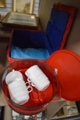 A vintage 1980's plastic picnic set for six as new with a similar red hamper.