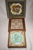 Three 19th century decorative tiles all being framed for wall display.