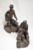 Two Heredities bronze effect figures of farm workers.