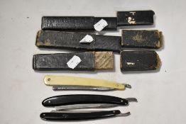 Three Victorian cut throat razor blades.