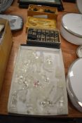 A glass chess set with a similar vintage wooden turned set and a box of Imperial double Dominoes.