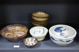 Four studio pottery bowls including one signed P.B 1950 and a set of five Denby bowls.