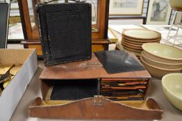An early 20th century Rochester Camera Company box plate camera with plates.