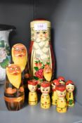 A set of two Mid Century Russian 'USSR' folk art matrioska dolls hand painted in a traditional