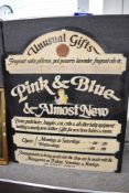 A mid 20th century hand painted shop sign advertising Pink & Blue and Almost New Unusual Gifts.