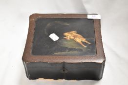 An antique Japan lacquer trinket case decorated with the scene of a Rabbit leaping towards the