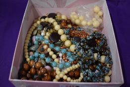 A small box of costume jewellery