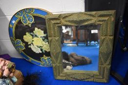 A mid century table top having rose design and a wooden framed tramp art mirror in green.