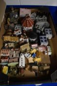 A selection of mostly modern ceramic model houses and cottages with a Staffordshire flatback