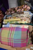 A box full of vintage and retro fabrics, a tweed skirt length and similar.