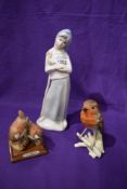 Three figure studies including a Goebel Robin, Armarni wrens and Lladro style lady.