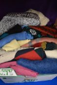 A box full of retro and traditional knit wear.