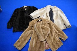 Three vintage faux fur coats and a wrap.