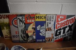 A collection of small metal reproduction motoring signs