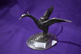 A Victorian spirit burning stand in the form of a Liver bird.