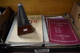 A box of early 20th century piano sheet music and a WIllner.