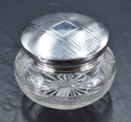 A George V silver topped glass powder bowl, of slightly domed circular top with engine-tuned