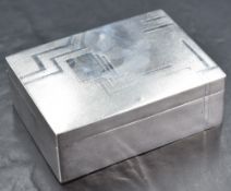 An imported silver cigarette box, of hinged rectangular form with etched Art Deco influenced