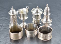 A group of mixed hallmarked silver items, to include pepperettes, small trophy marked 'Yokohama 1918