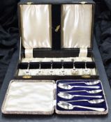 A cased set of six 1930's silver golfing interest teaspoons, having crossed golf club and ball motif