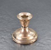 A Queen Elizabeth II silver squat candlestick, with reeded decoration, marks for Birmingham 1958,