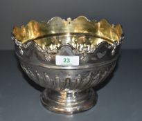 A Victorian silver punch bowl, the rim moulded with repeating arched design over a moulded band