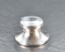 A Queen Elizabeth II silver capstan type inkwell, marks for Birmingham 1994, maker S&Co, marked '