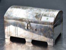 An Edwardian silver jewellery casket, of domed and hinged rectangular form with engraved Laurel,