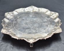 A Victorian silver salver, of shaped circular form with moulded rim with scalloped detail