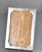 A George V silver mounted photograph frame, of rectangular form with engine-turned decoration and