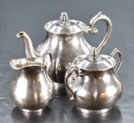 An early 20th century (pre 1947) sterling 'white metal' three piece bachelors teaset, of lobed