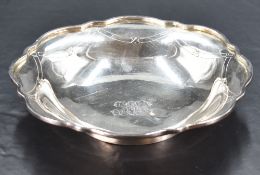 A Japanese Sterling grade white metal dish, of dished and shaped circular form with swag