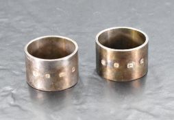 A pair of Queen Elizabeth II silver napkin rings, of plain circular form, enlarged marks for