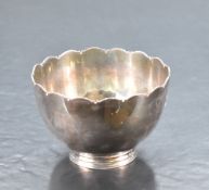 An unusual 20th century Irish silver bowl, of plain dished cylindrical form with lobed rim and short