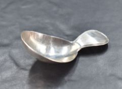 A George III silver caddy spoon, nicely proportioned with oval bowl and short moulded handle,