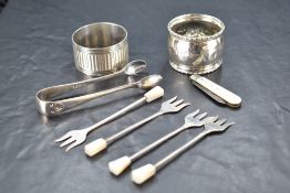 A group of four 1930's mother-of-pearl handled silver pickle tridents, marks for Sheffield 1934,