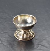 A Continental white metal bowl, of circular form with moulded rim , the base petal moulded, marked
