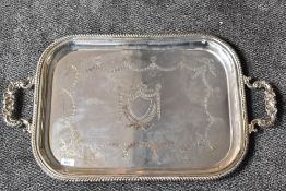 A large and impressive Edwardian silver two-handled tray, of rounded rectangular form, the scroll