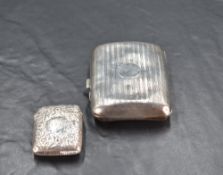 A George V silver cigarette case, of hinged rectangular form, curved for the gentleman's pocket
