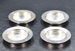 A group of four early Queen Elizabeth II silver dishes, of plain dished circular form with star-