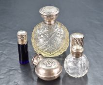 A Victorian silver scent bottle, of spirally fluted cylindrical form with hinged cover engraved with